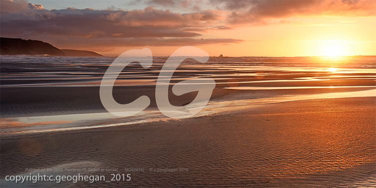 Painted on the sand, Perranporth Beach at sunset